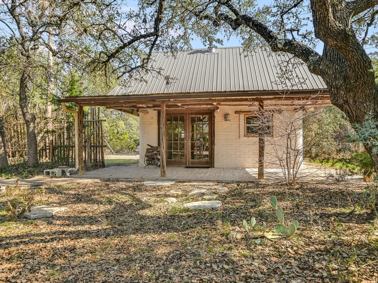 adobe style casita with kitchen, living, full bathroom and sleeping loft.