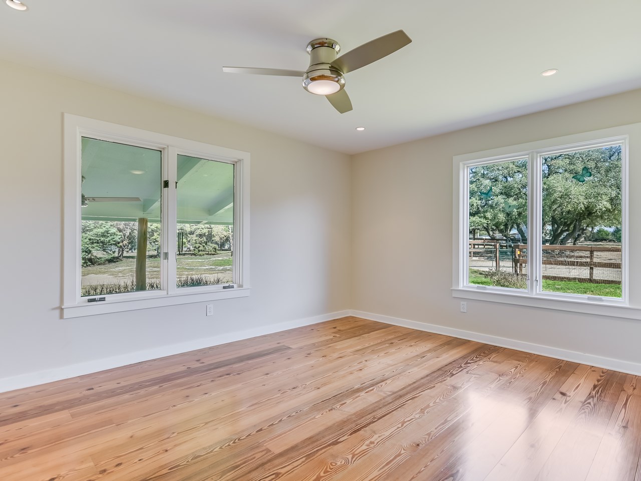large bedroom with walk in closet and peaceful private views