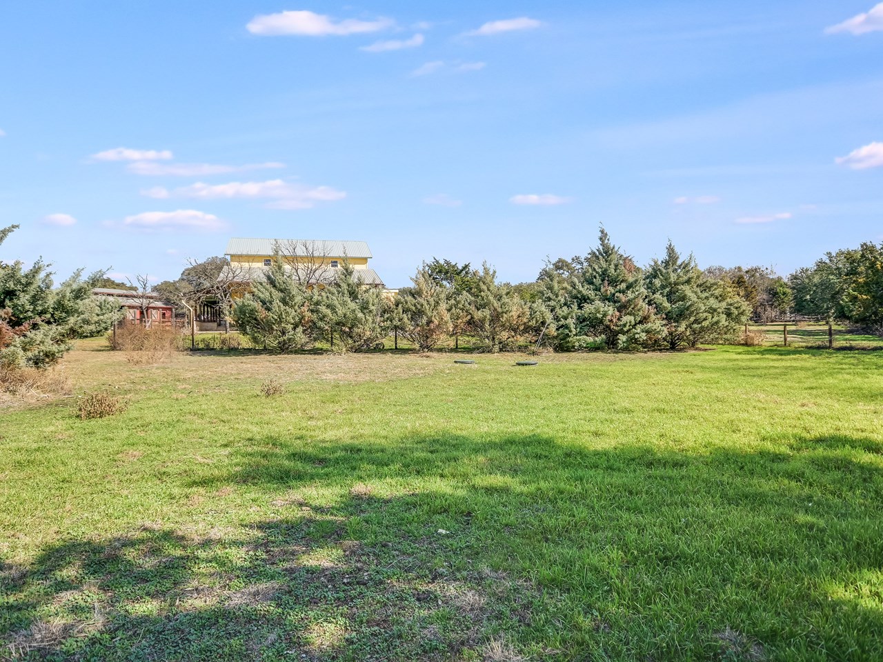 front pasture with arena area. fully fenced and crossed fenced