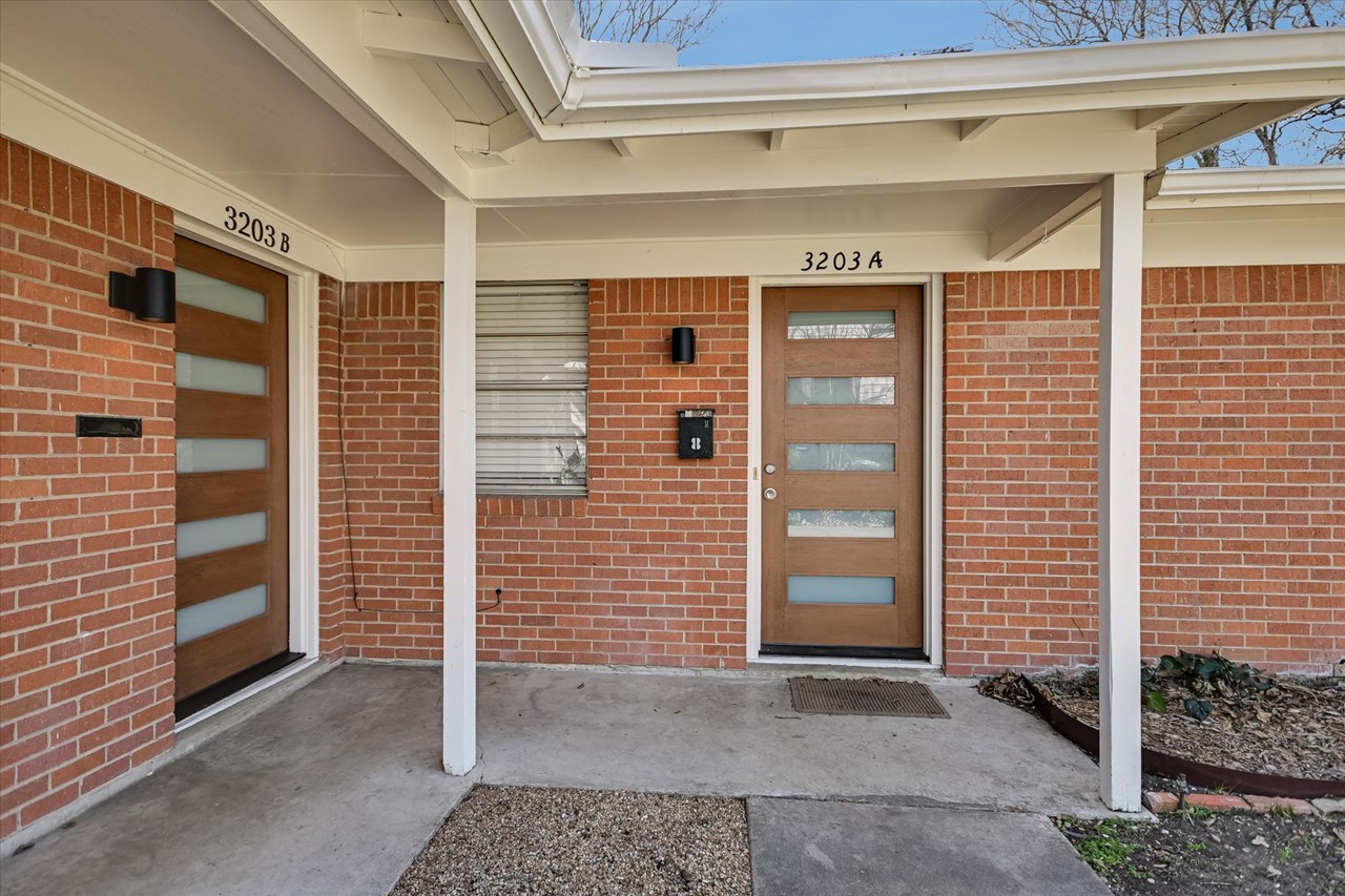 updated contemporary front entrance with new doors and lighting