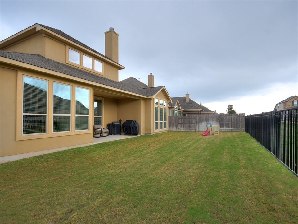 expansive back yard with greenbelt views
